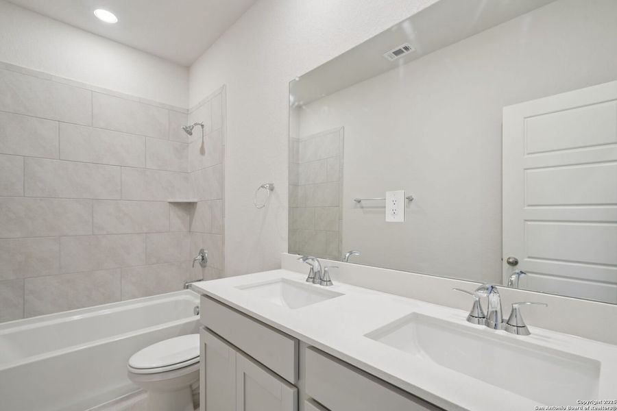 Furnished interior view inside a new home in Estancia Ranch - Premier Series, San Antonio (Image 11).