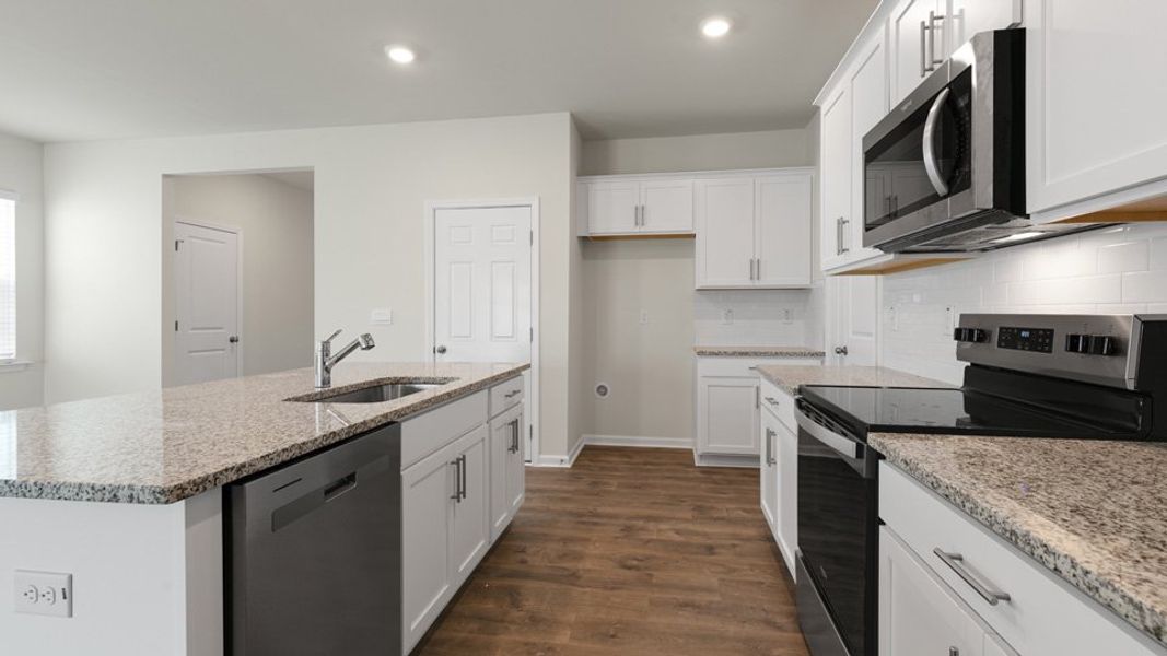 Furnished interior view inside a new home in The Grove at Matthews Landing, Fuquay Varina (Image 5).
