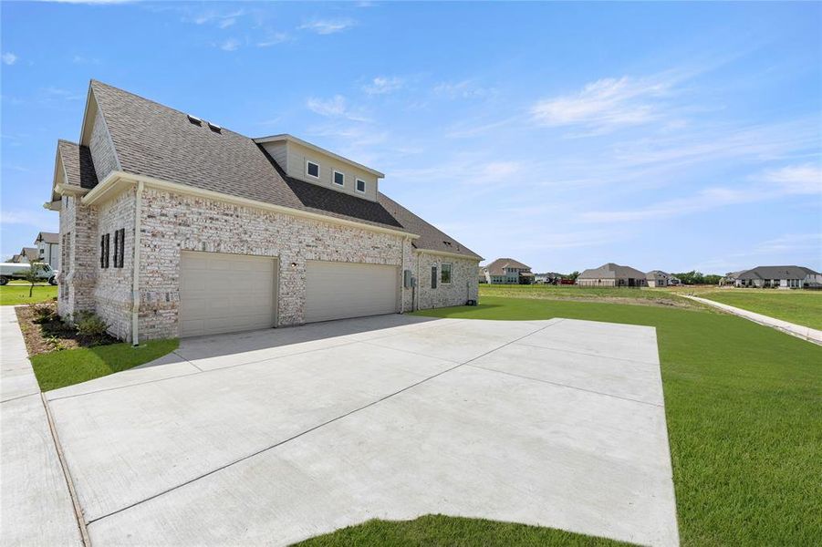 Front exterior of a new home in Ridge Park Estates, Royse City, TX, highlighting curb appeal (Image 1). Front exterior of a new home in Ridge Park Estates, Royse City, TX, highlighting curb appeal (Image 1).