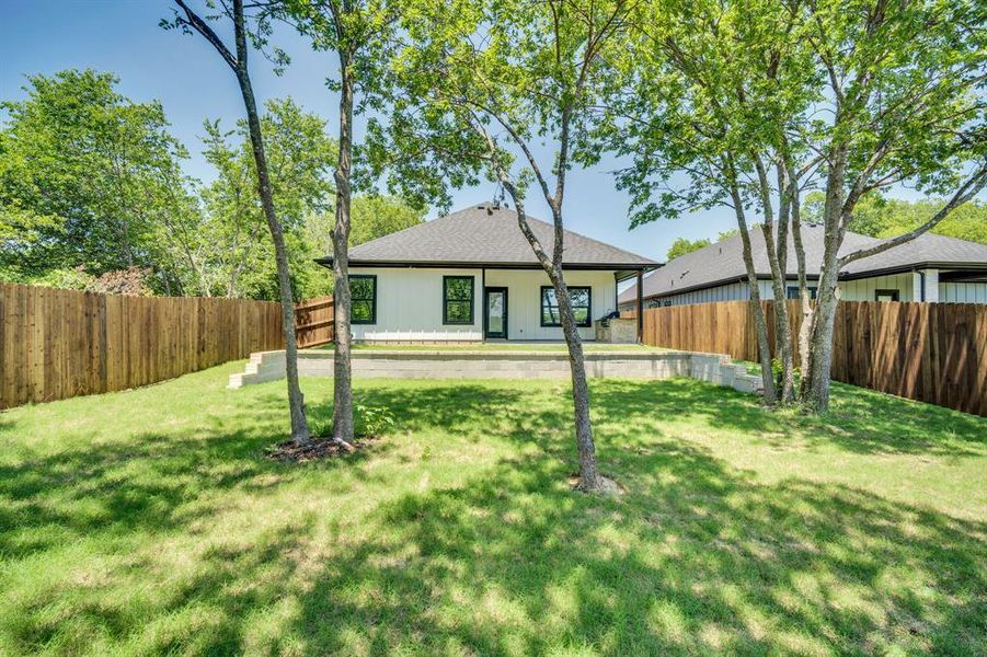 Enjoy this private and inviting backyard.  Great shade trees. Sprinkler system.