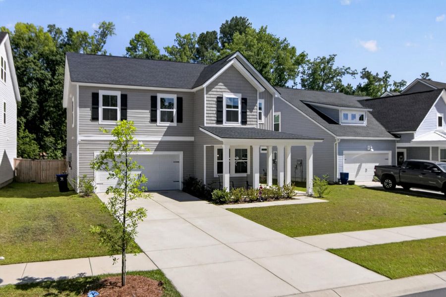 Front exterior of a new home in Limehouse Village: Arbor Series, Summerville, SC, highlighting curb appeal (Image 24). Front exterior of a new home in Limehouse Village: Arbor Series, Summerville, SC, highlighting curb appeal (Image 24).