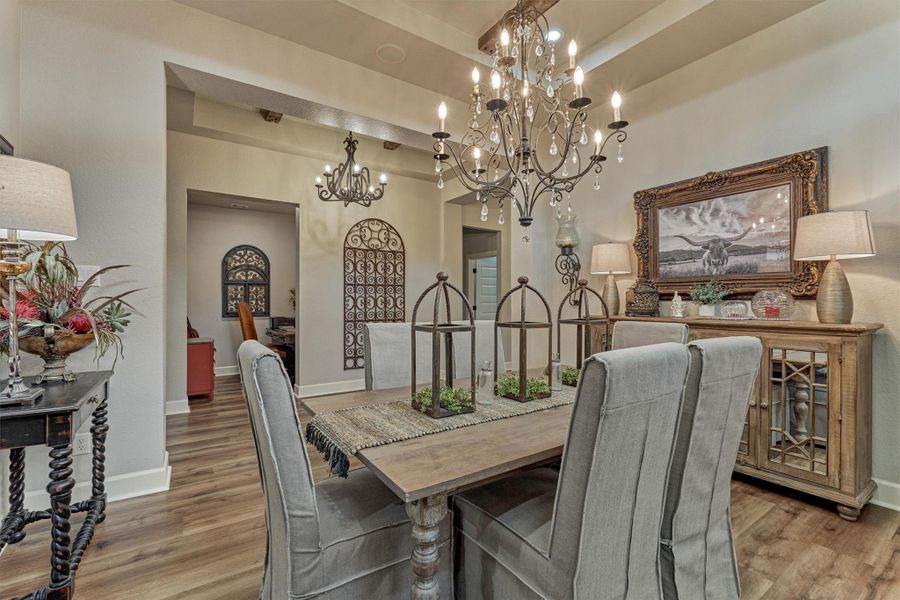 The formal dining opens towards a versatile nook, ideal as a home office, or a cozy reading space. The formal dining opens towards a versatile nook, ideal as a home office, or a cozy reading space.