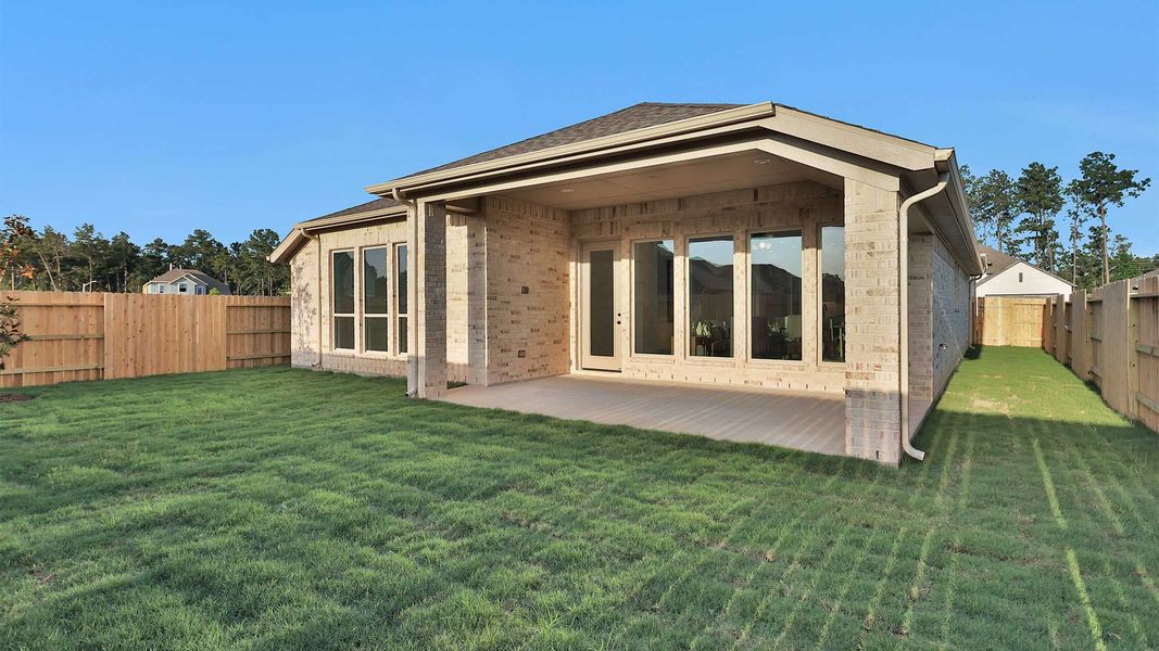 Exterior details and patio area of a home in Artavia, Conroe (Image 2).