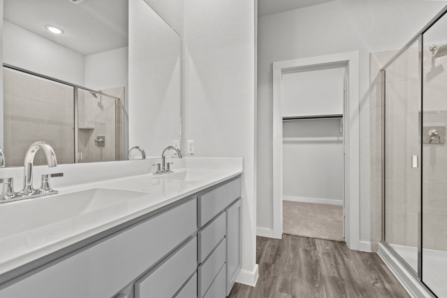 A bathroom with a glass shower.