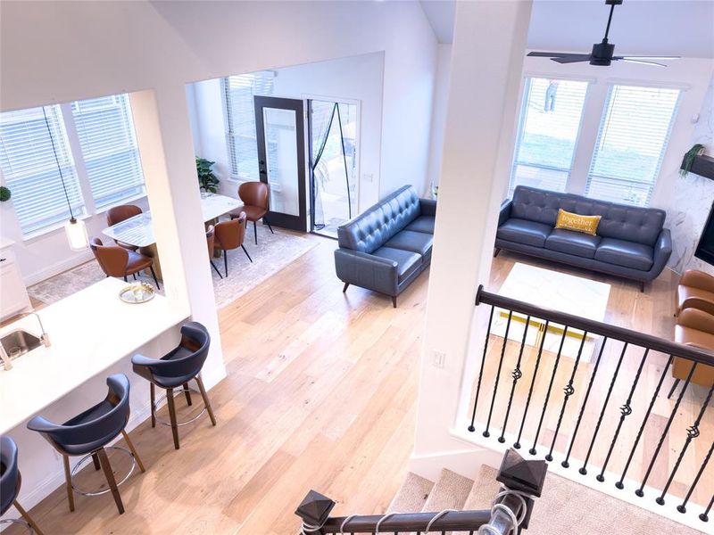 Living room featuring light wood-style floors and ceiling fan