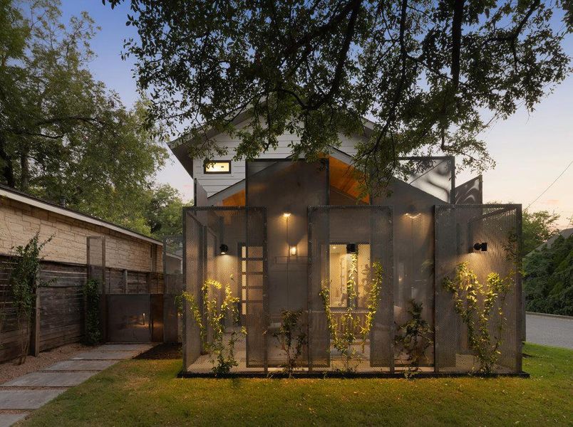 Modern home featuring a front lawn Modern home featuring a front lawn