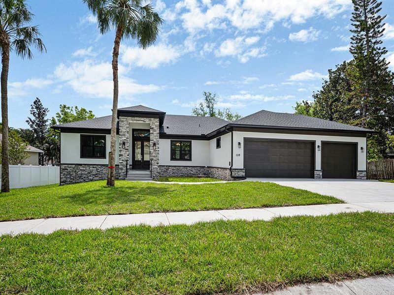 Front exterior of a new home in , Safety Harbor, FL, highlighting curb appeal (Image 24).