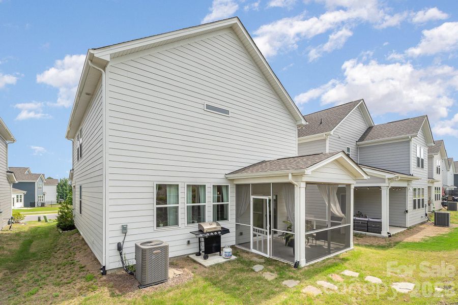 Exterior details and patio area of a home in Village at North Reach, Charlotte (Image 26).