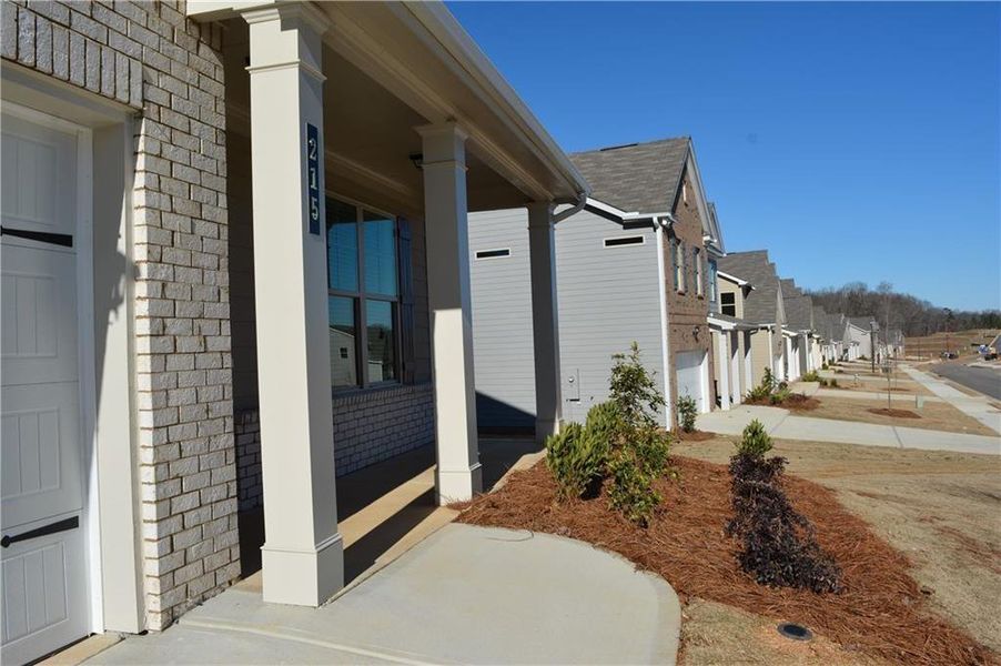 Front exterior of a new home in , Braselton, GA, highlighting curb appeal (Image 18). Front exterior of a new home in , Braselton, GA, highlighting curb appeal (Image 18).