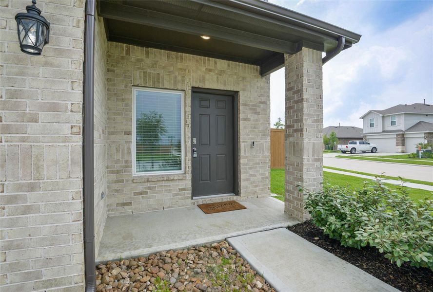 Front exterior of a new home in River Ranch Meadows, Dayton, TX, highlighting curb appeal (Image 17). Front exterior of a new home in River Ranch Meadows, Dayton, TX, highlighting curb appeal (Image 17).