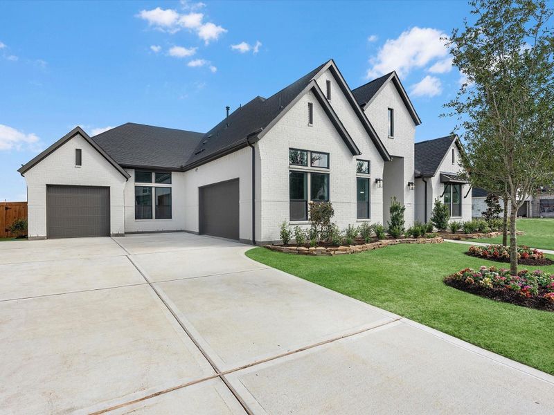 Front exterior of a new home in Dunham Pointe, Cypress, TX, highlighting curb appeal (Image 22).