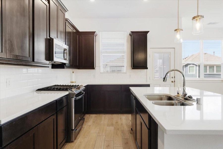Furnished interior view inside a new home in Meridiana, Iowa Colony (Image 12).
