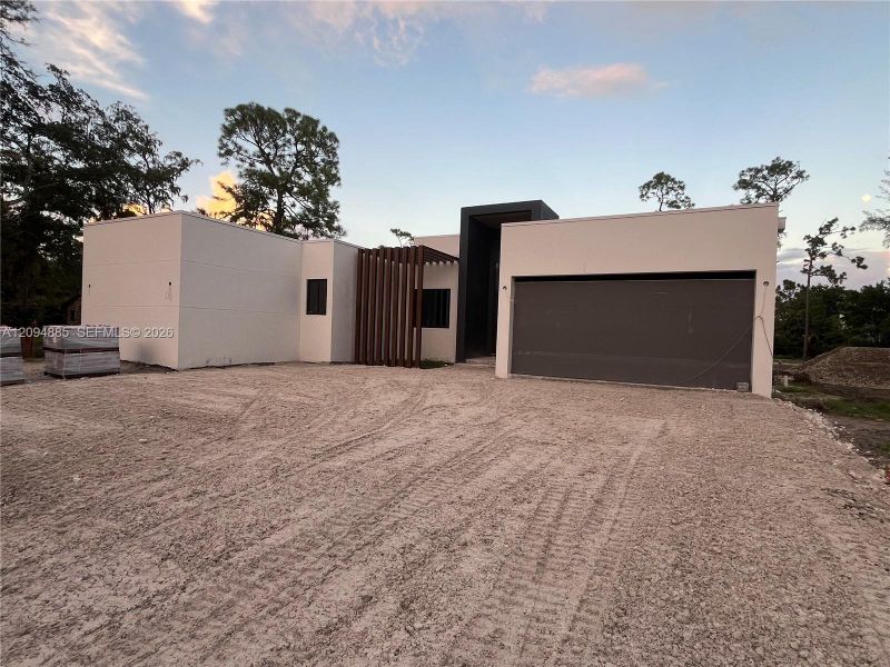 Front exterior of a new home in , Parkland, FL, highlighting curb appeal (Image 7).