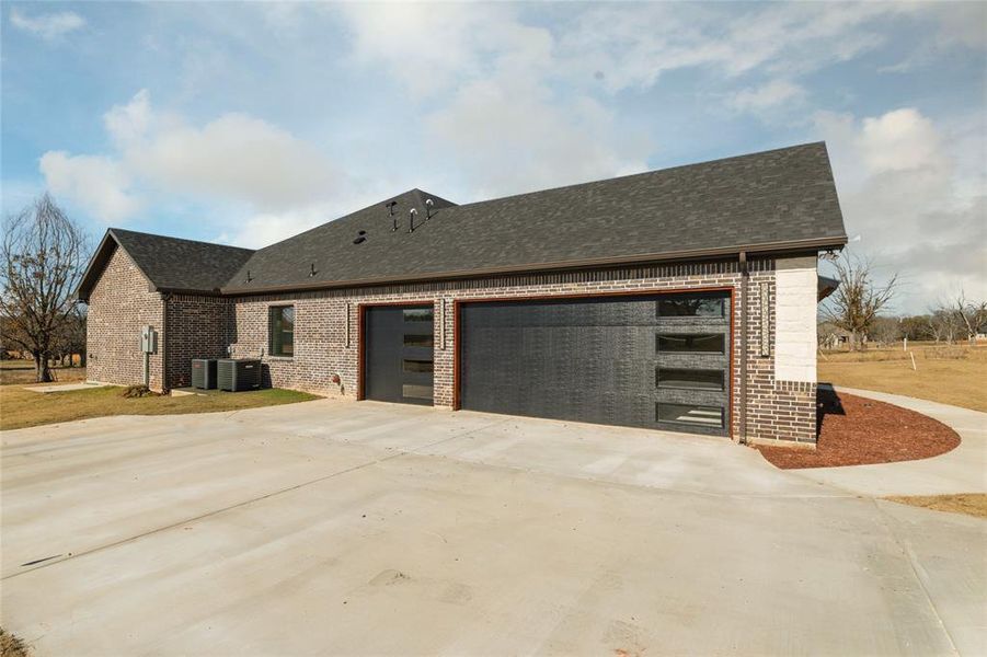 Front exterior of a new home in , Granbury, TX, highlighting curb appeal (Image 26).