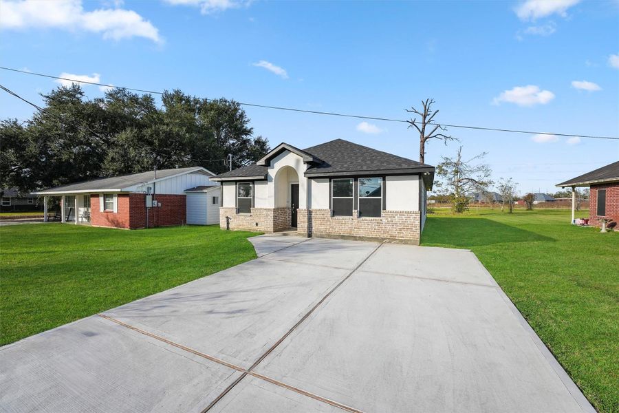 Front exterior of a new home in , Dayton, TX, highlighting curb appeal (Image 1).