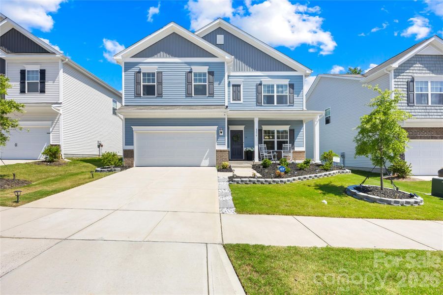 Front exterior of a new home in Orchard Creek, Charlotte, NC, highlighting curb appeal (Image 22).