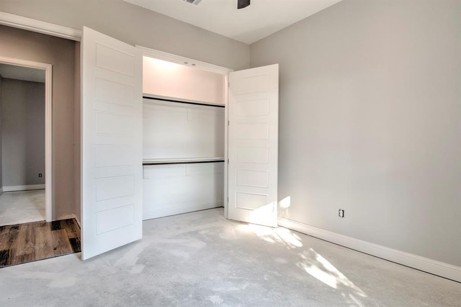 Unfurnished bedroom featuring light colored carpet and a closet