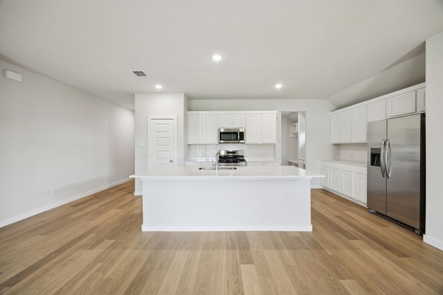 Kitchen in the Heisman home plan by Trophy Signature Homes – REPRESENTATIVE PHOTO Kitchen in the Heisman home plan by Trophy Signature Homes – REPRESENTATIVE PHOTO
