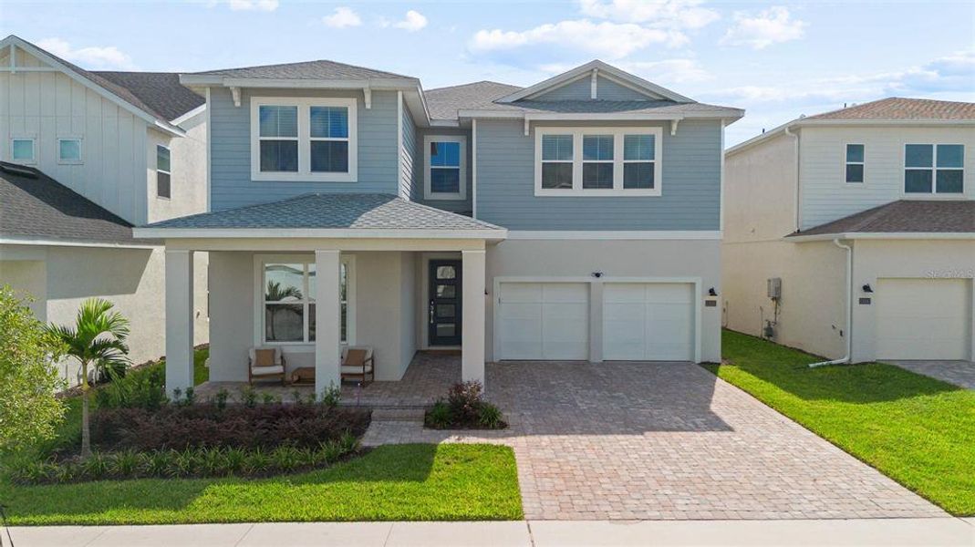 Front exterior of a new home in , Winter Garden, FL, highlighting curb appeal (Image 2). Front exterior of a new home in , Winter Garden, FL, highlighting curb appeal (Image 2).