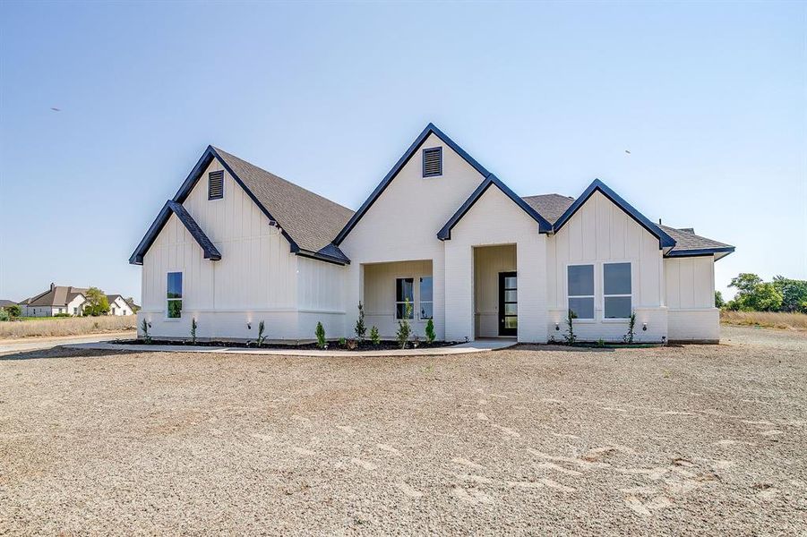 Front exterior of a new home in , Weatherford, TX, highlighting curb appeal (Image 23).