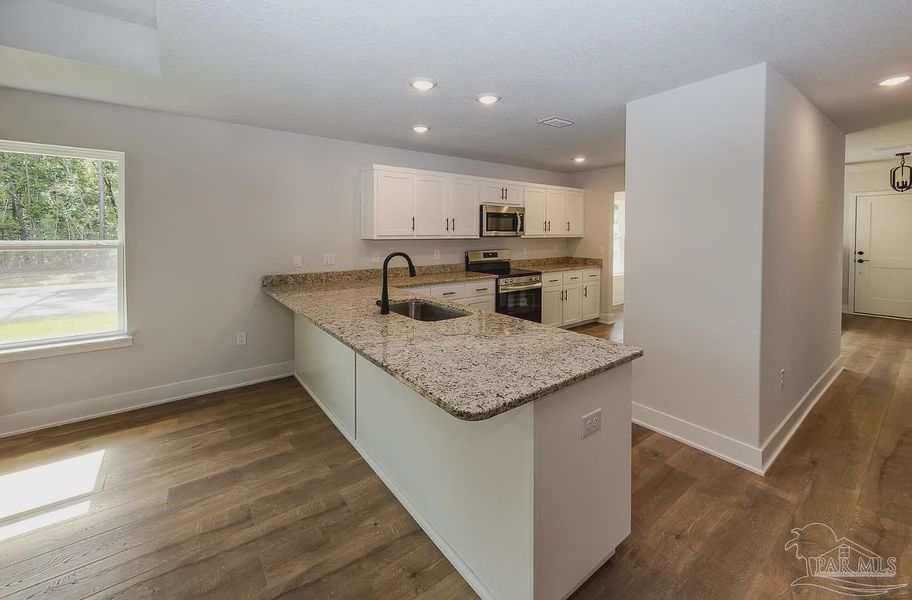 Furnished interior view inside a new home in Hidden Pines, Milton (Image 5).