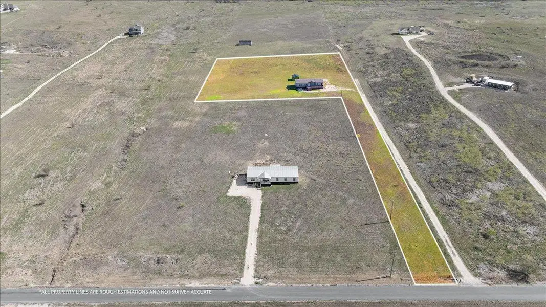 Aerial view of property and surrounding area with rural landscape. Lot lines are rough estimations and not survey accurate. Aerial view of property and surrounding area with rural landscape. Lot lines are rough estimations and not survey accurate.