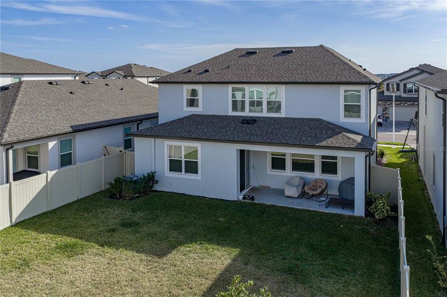 Exterior details and patio area of a home in Epperson, Wesley Chapel (Image 28).
