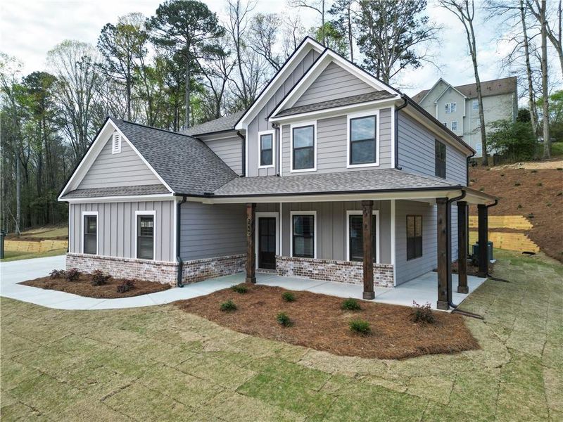 Front exterior of a new home in Red Oak Ridge, Loganville, GA, highlighting curb appeal (Image 2). Front exterior of a new home in Red Oak Ridge, Loganville, GA, highlighting curb appeal (Image 2).