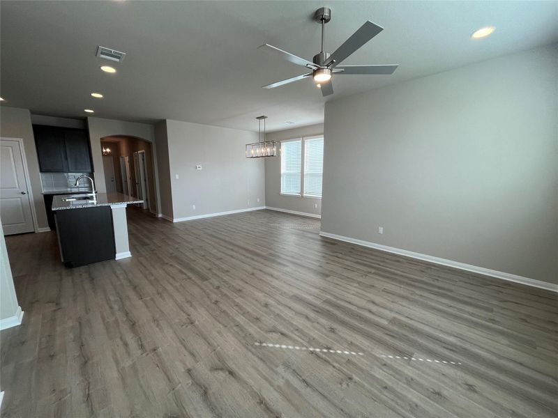 An open floorplan design seamlessly connects the living space to the adjacent kitchen. An open floorplan design seamlessly connects the living space to the adjacent kitchen.