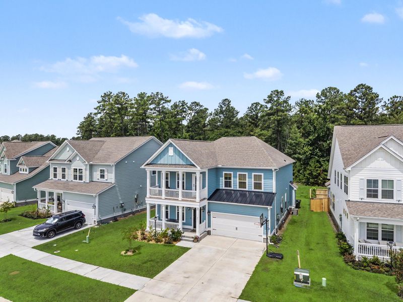 Front exterior of a new home in Tidewater at Lakes of Cane Bay, Summerville, SC, highlighting curb appeal (Image 23).