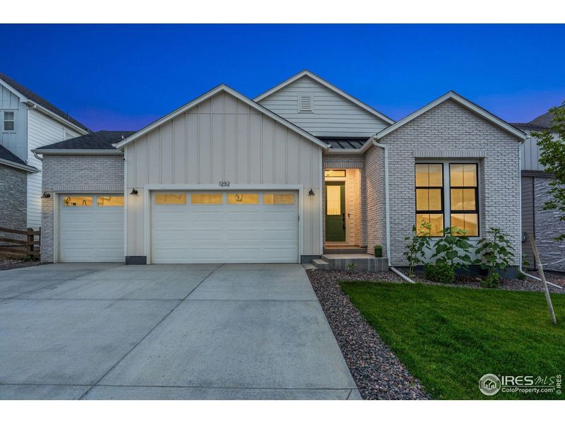 Front exterior of a new home in , Timnath, CO, highlighting curb appeal (Image 20).