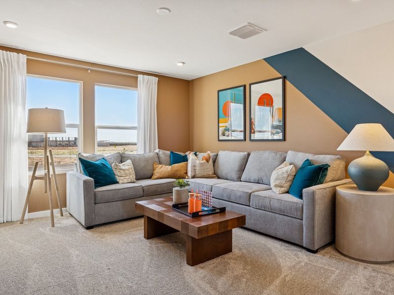 A living room with a couch and a coffee table. A living room with a couch and a coffee table.