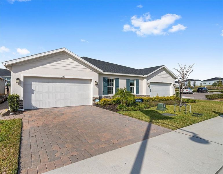 Front exterior of a new home in , Lady Lake, FL, highlighting curb appeal (Image 21). Front exterior of a new home in , Lady Lake, FL, highlighting curb appeal (Image 21).