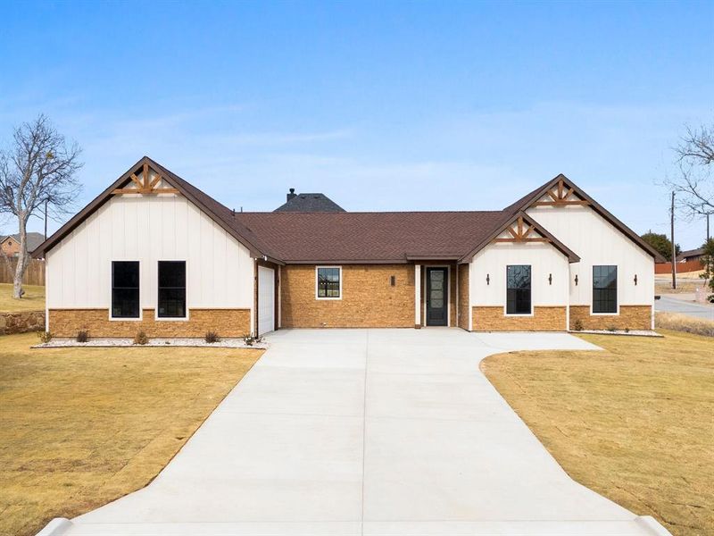 Front exterior of a new home in , Granbury, TX, highlighting curb appeal (Image 2). Front exterior of a new home in , Granbury, TX, highlighting curb appeal (Image 2).