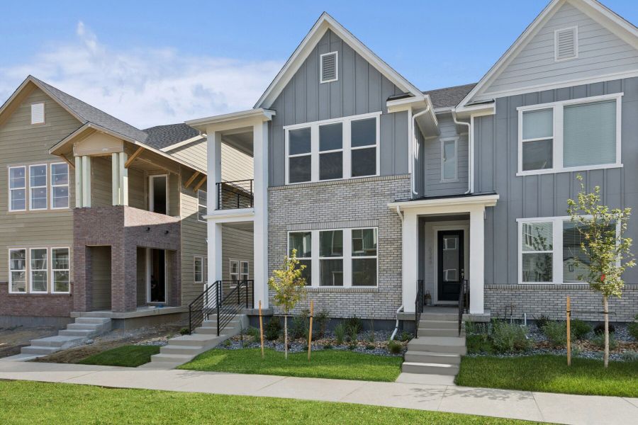 Front exterior of a new home in Kinston Mainstreet Townhomes, Loveland, CO, highlighting curb appeal (Image 17).