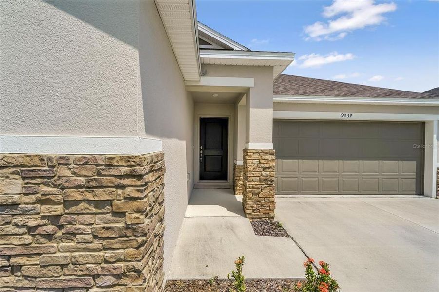 Front exterior of a new home in , Davenport, FL, highlighting curb appeal (Image 26). Front exterior of a new home in , Davenport, FL, highlighting curb appeal (Image 26).