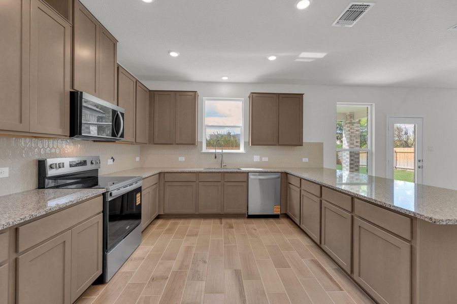 Furnished interior view inside a new home in Mustang Valley, Manor (Image 8).