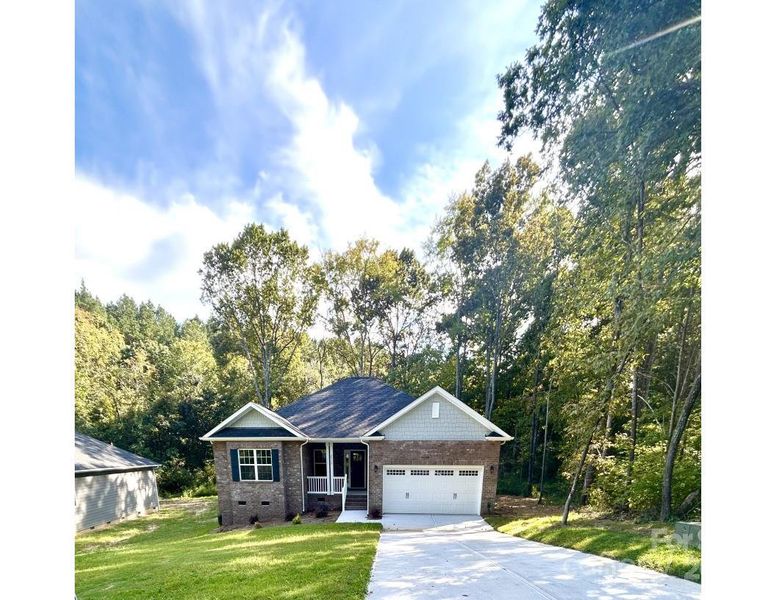 Front exterior of a new home in Crystal Village, Albemarle, NC, highlighting curb appeal (Image 1). Front exterior of a new home in Crystal Village, Albemarle, NC, highlighting curb appeal (Image 1).