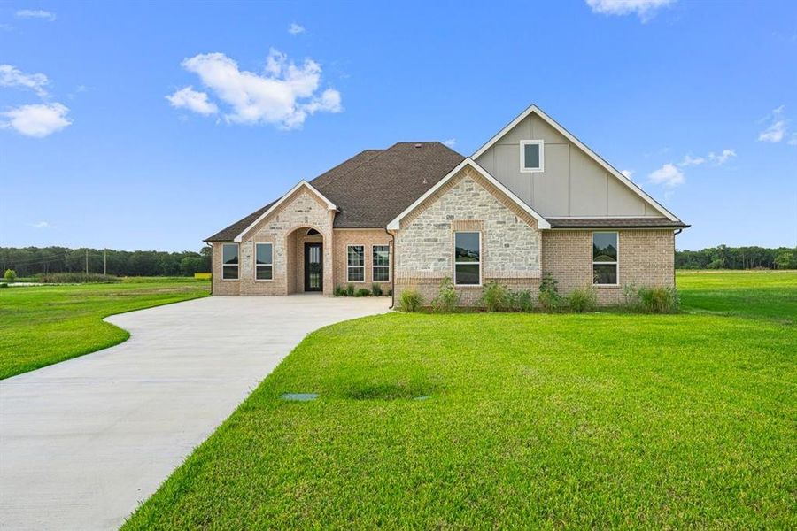 Front exterior of a new home in , Corsicana, TX, highlighting curb appeal (Image 1). Front exterior of a new home in , Corsicana, TX, highlighting curb appeal (Image 1).