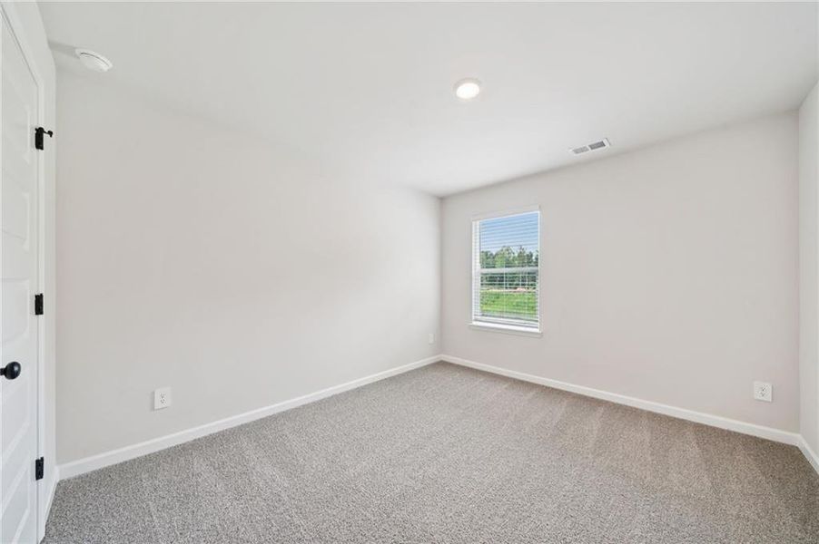 Spacious, unfurnished interior of a new home in Vines at Mill Creek - Estate Series, Braselton (Image 31).