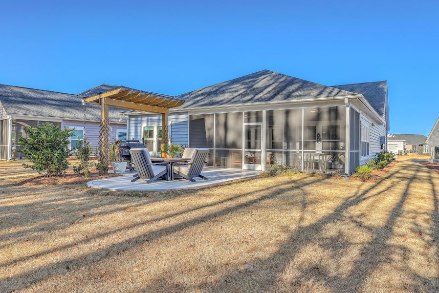 Exterior details and patio area of a home in Horizons at Summers Corner | 55+: The Legends, Summerville (Image 3).