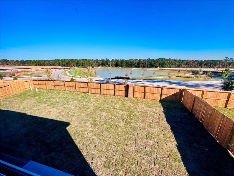 Exterior details and patio area of a home in Spring Creek Trails, Magnolia (Image 3).