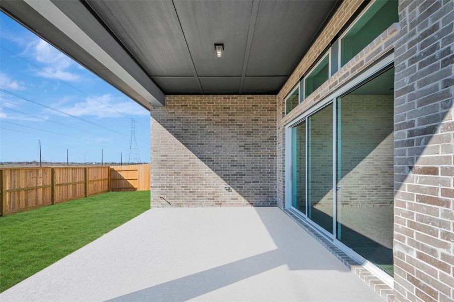 Exterior details and patio area of a home in Elyson - Reserve Collection, Katy (Image 3).