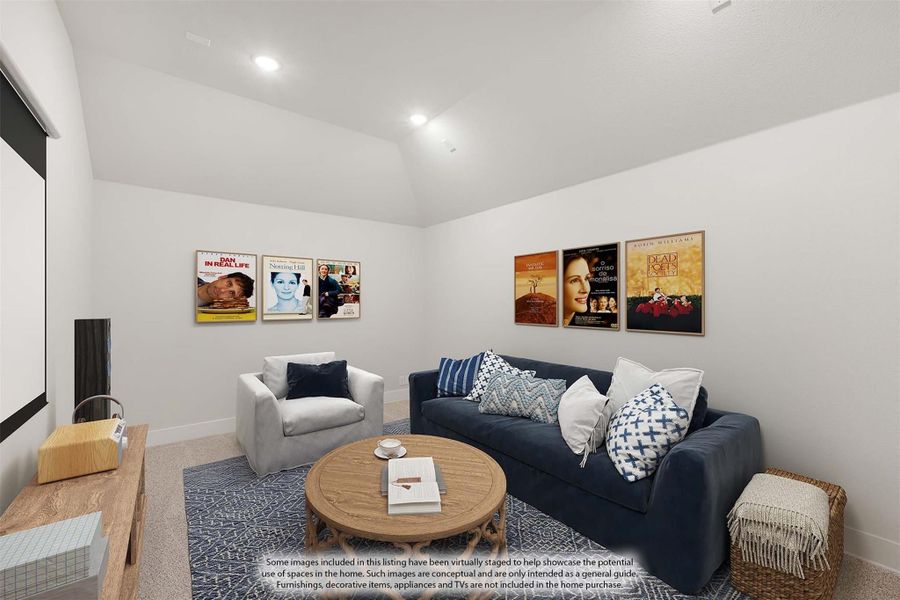 Media room with projection screen, navy sofa, armchair, and movie posters on white walls