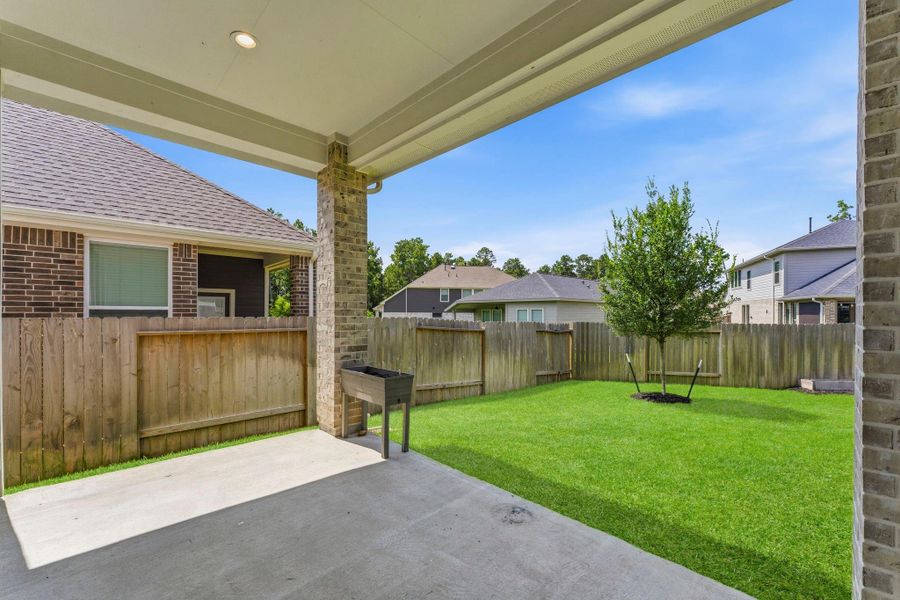 Exterior details and patio area of a home in Woodforest, Montgomery (Image 3).