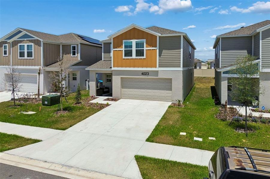 Front exterior of a new home in , Haines City, FL, highlighting curb appeal (Image 22).
