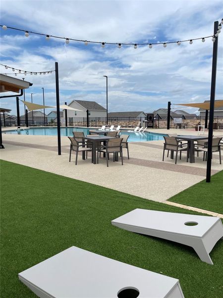 View of community featuring a pool and a patio