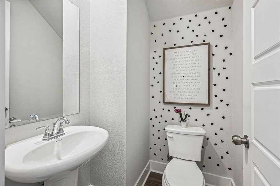 Half bathroom with sink and LVP flooring