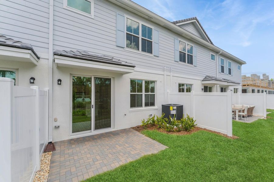 Front exterior of a new home in Salerno Reserve Townhomes, Stuart, FL, highlighting curb appeal (Image 21).