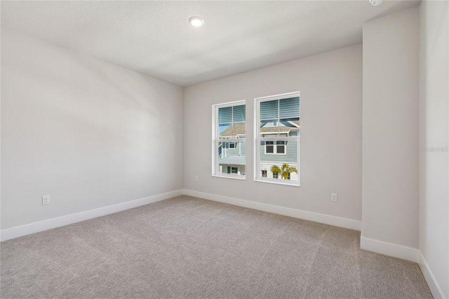 Spacious, unfurnished interior of a new home in Emerald Landing at Waterside at Lakewood Ranch – Cottage Series, Sarasota (Image 35).